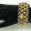 Armband mit facettierten Granat Perlen, Gelbgold, Breite 35mm, 4 reihig